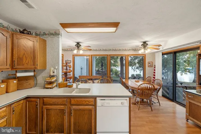 a kitchen with a refrigerator and a stove