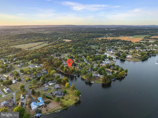 a bathroom with a sink a mirror and a shower curtain
