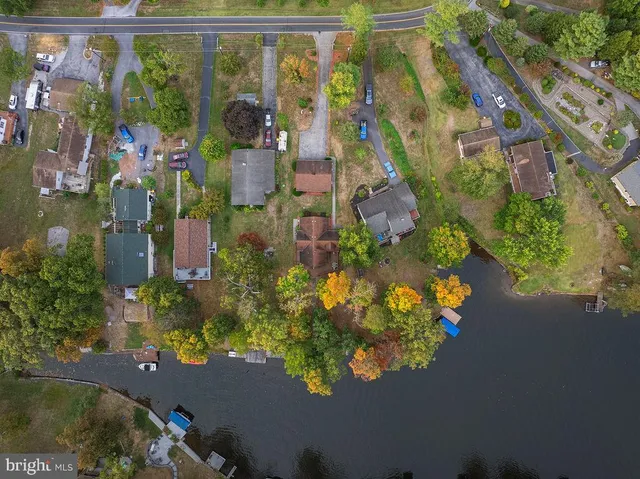 a bathroom with a sink a toilet and shower curtain