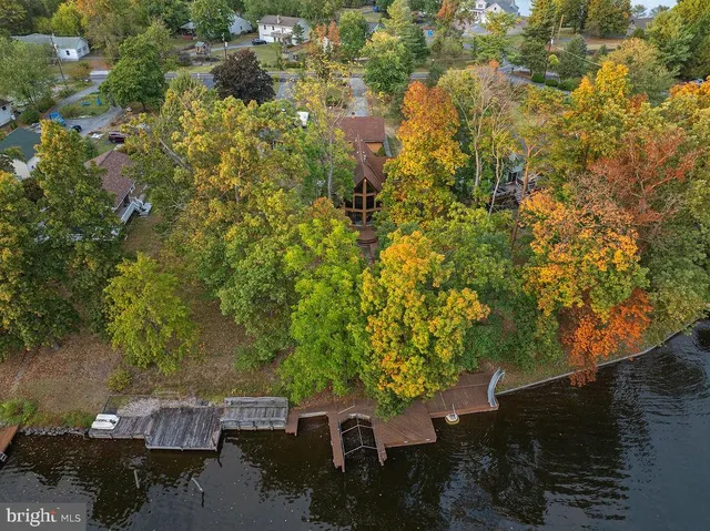 a bedroom with a bed and a closet with mirror