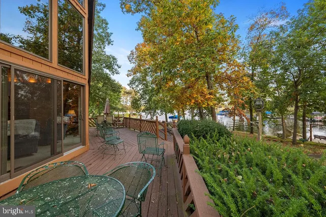 a swimming pool with outdoor seating and garden