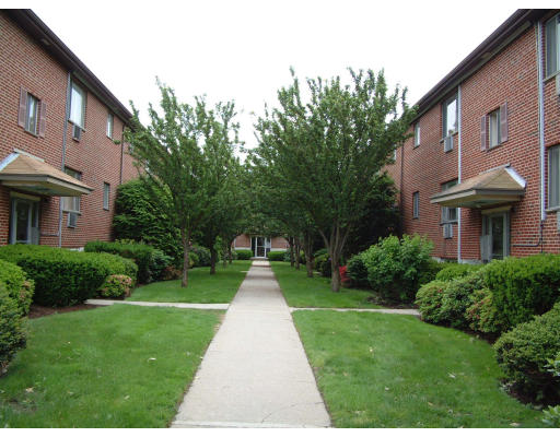 62 Bryon Road, Unit 2 62 Boston, MA 02467 - Photo 1 of 1 a front view of a house with garden