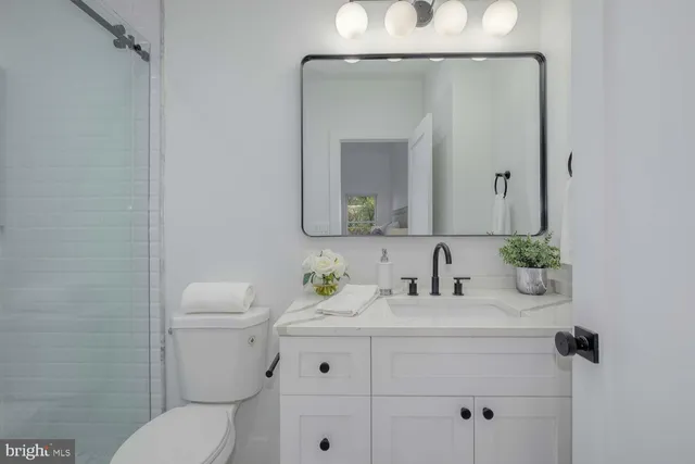 a bedroom with a bed and a chair