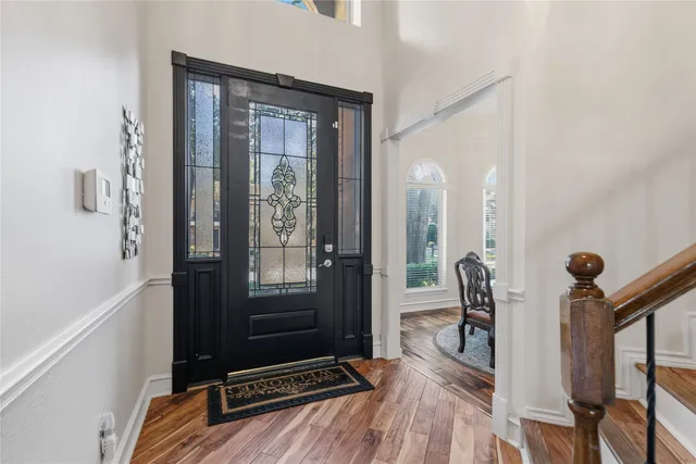 a view of room with furniture and wooden floor