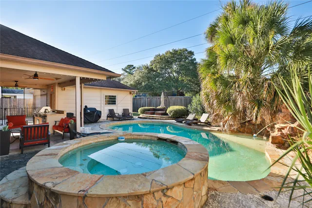 a view of a swimming pool with a patio