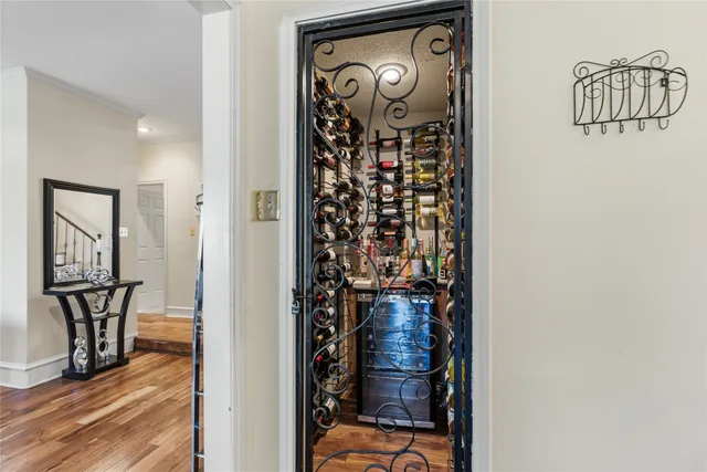 a view of a hallway with wooden floor and entryway