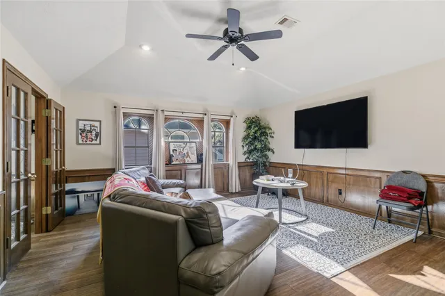 a living room with furniture or couch and a flat screen tv