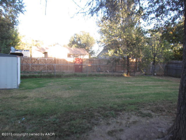 4321 Gables Street Amarillo, TX 79110 - Photo 3 of 13 a view of a yard with a tree