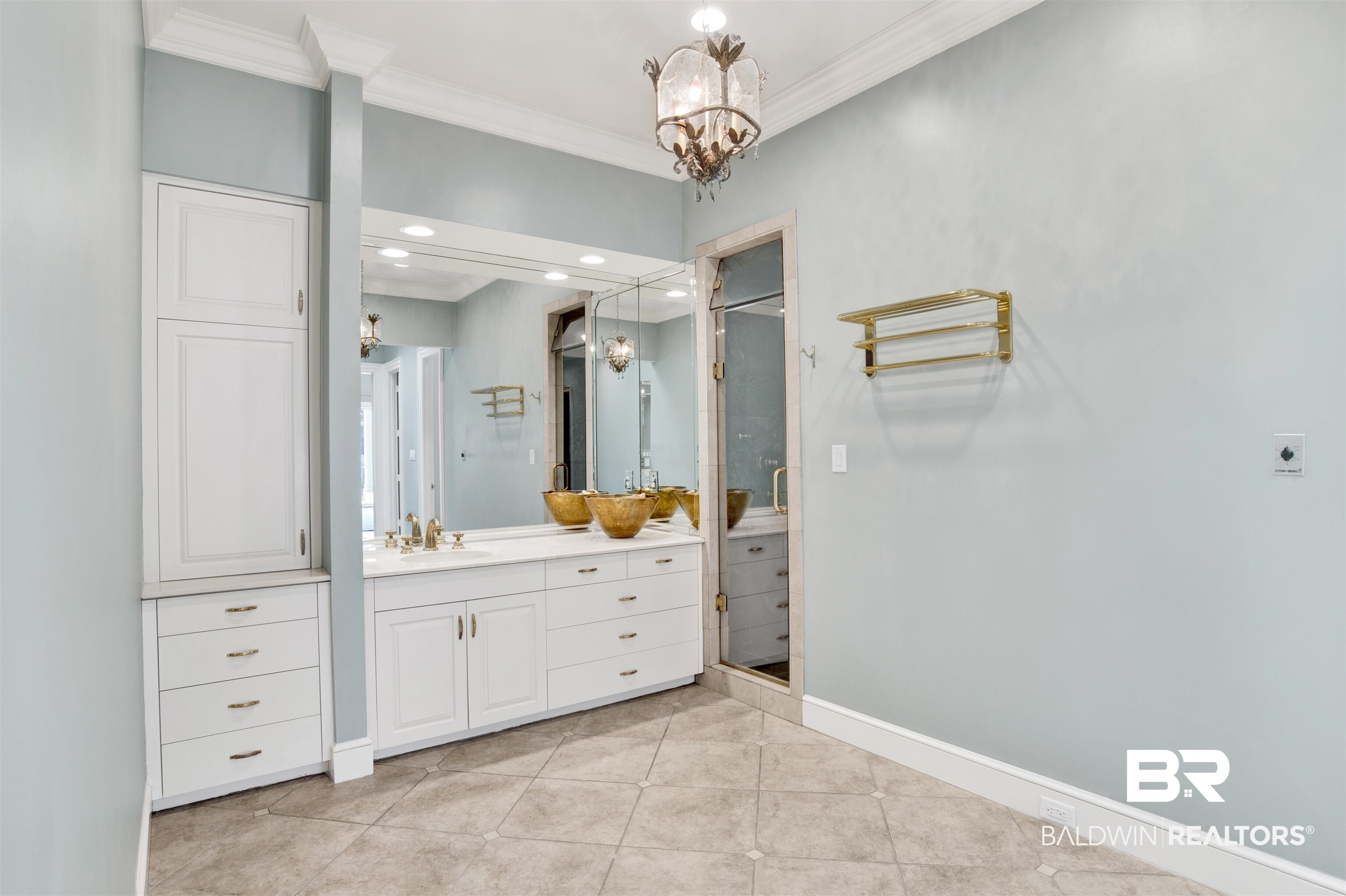 3816 Austill Lane Mobile, AL 36608 - Photo 34 of 80 Full bath featuring vanity, a stall shower, tile patterned flooring, crown molding, and a chandelier