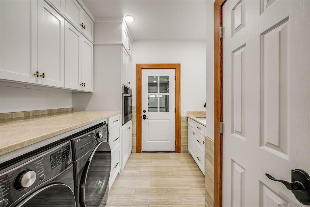 1037 Harrison Road Denison, TX 75021 - Photo 30 of 39 Utility space featuring white shaker-style cabinetry with gold-tone hardware, light-toned countertops, and light wood-finish flooring