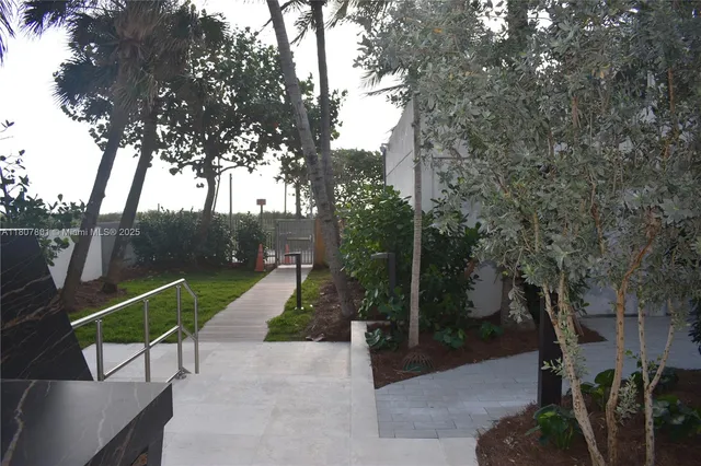 a view of swimming pool with outdoor seating and plants