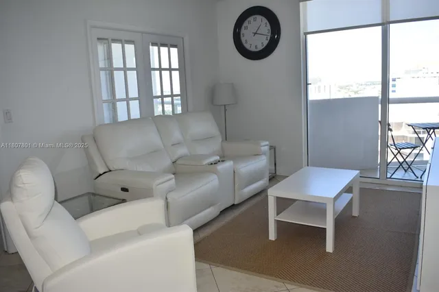 a living room with furniture and a table