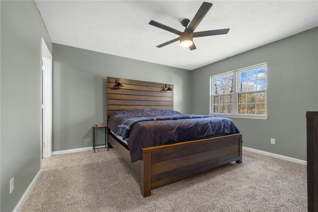 10974 Ricks Drive Harrison, AR 72601 - Photo 23 of 59 Bedroom with a ceiling fan and light carpet