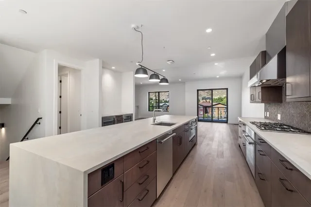 a bathroom with a double vanity sink mirror and shower