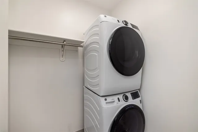 a front view of a residential apartment building with a yard