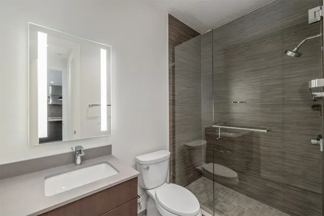 a front view of a residential apartment building with a yard