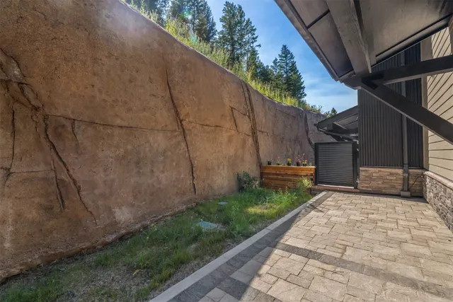 an outdoor space with patio couch and chairs