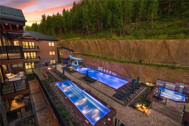 a kitchen with a table and chairs in it
