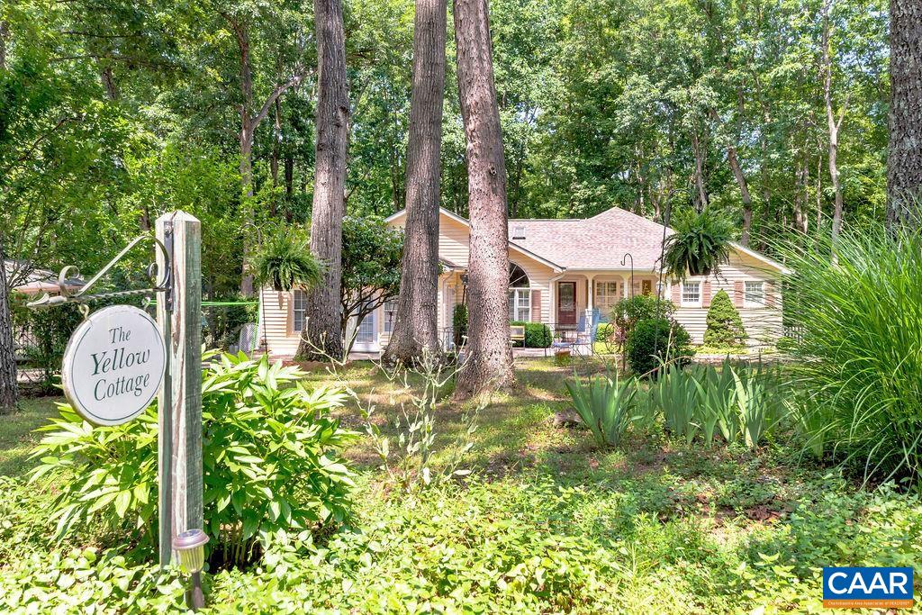 31 Out Of Bounds Road Palmyra, VA 22963 - Photo 2 of 41 a front view of a house with garden