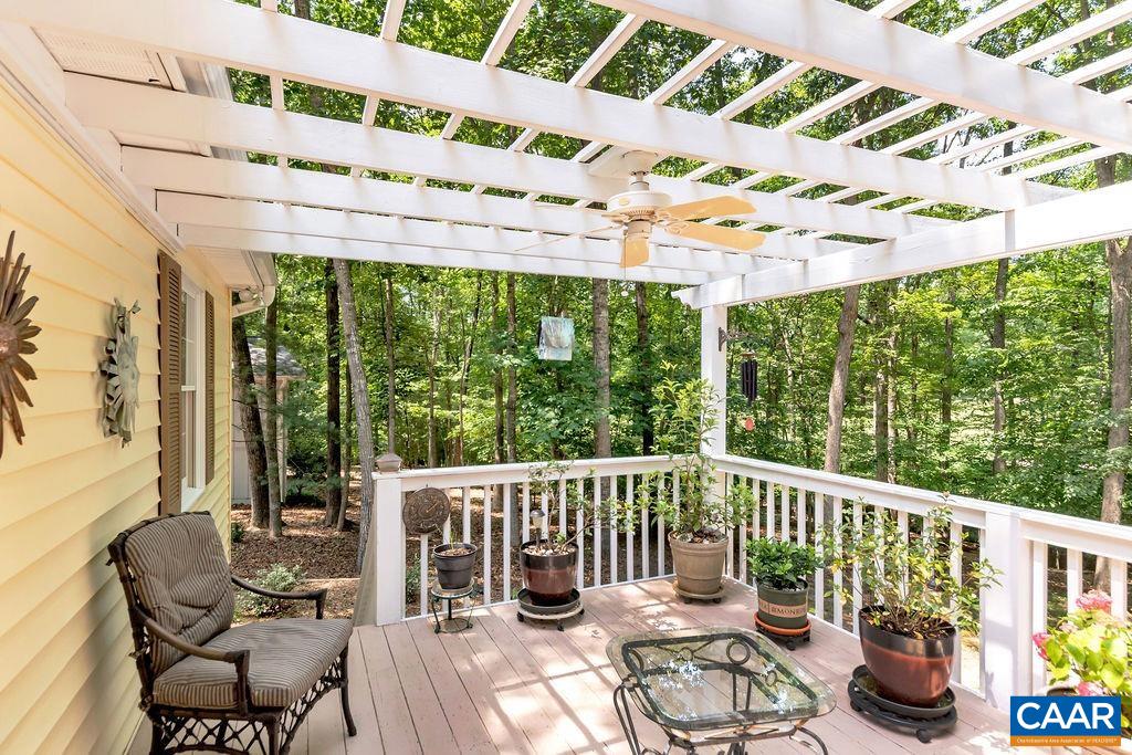 31 Out Of Bounds Road Palmyra, VA 22963 - Photo 31 of 41 a view of a chair and tables chairs in the patio