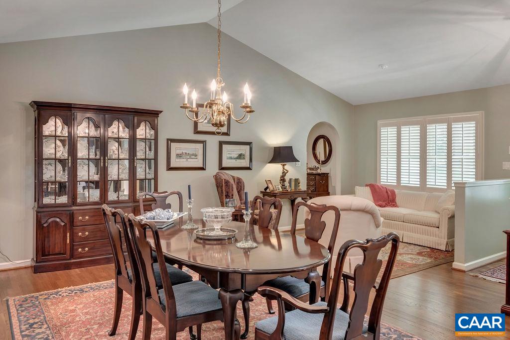 31 Out Of Bounds Road Palmyra, VA 22963 - Photo 5 of 41 a view of a dining room with furniture a chandelier and wooden floor