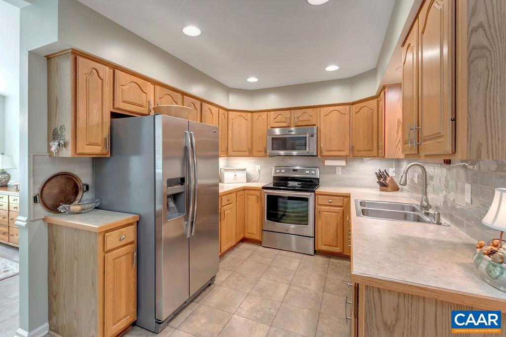 31 Out Of Bounds Road Palmyra, VA 22963 - Photo 7 of 41 a kitchen with stainless steel appliances granite countertop a refrigerator sink and stove