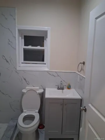 a view of hallway with wooden floor