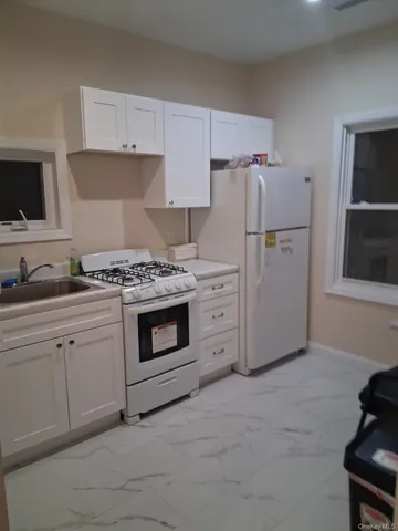 a view of hallway with wooden floor