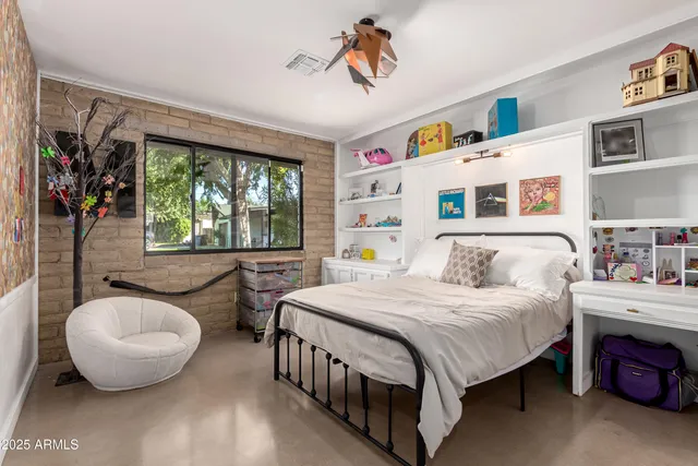 a living room with furniture cabinets and a book shelf