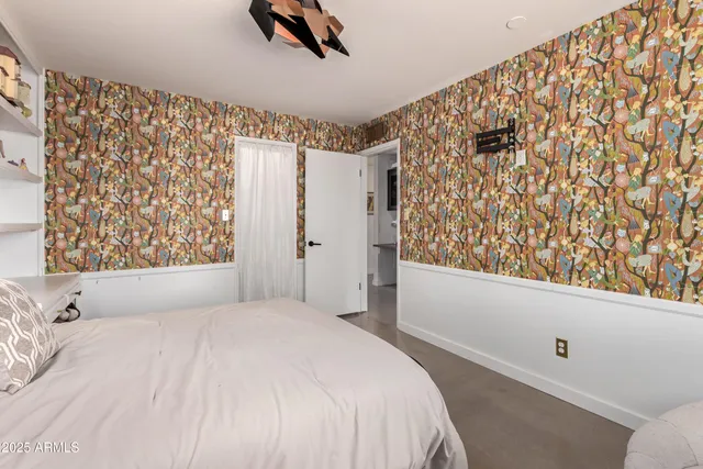 a bedroom with double bed and a window