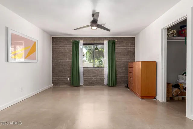 a view of a house with a backyard porch and sitting area