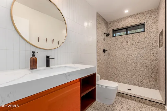 a view of a house with pool fire pit a table and chairs