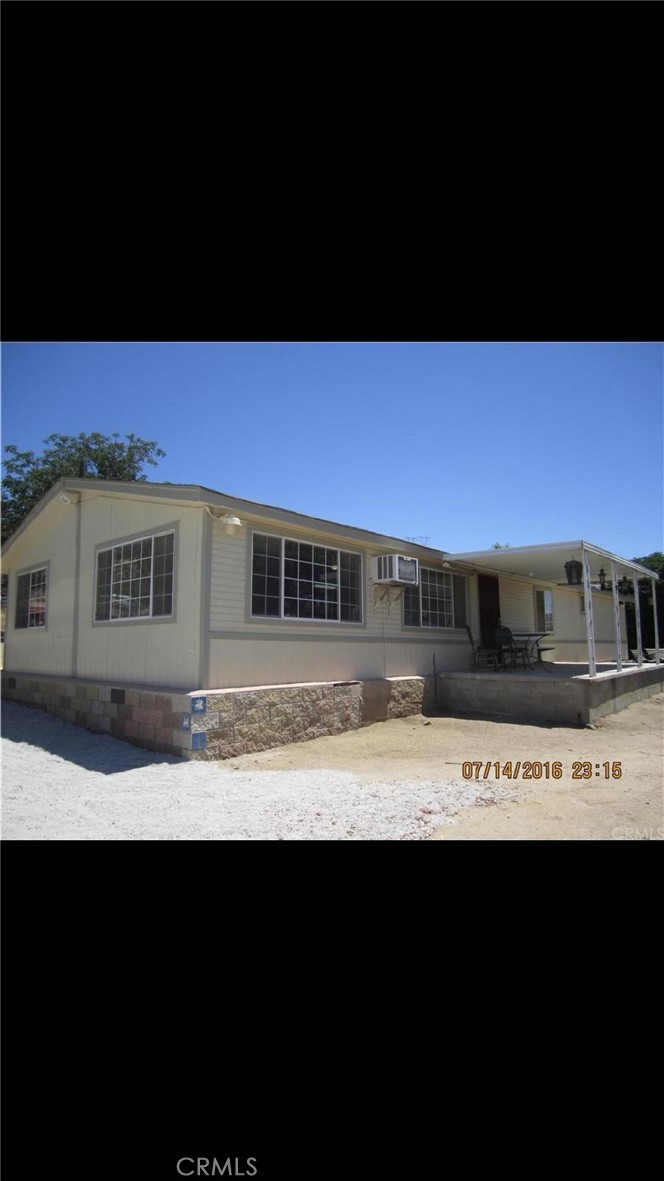 23310 Gunther Road Menifee, CA 92585 - Photo 1 of 1 a view of a big yard with an outdoor space