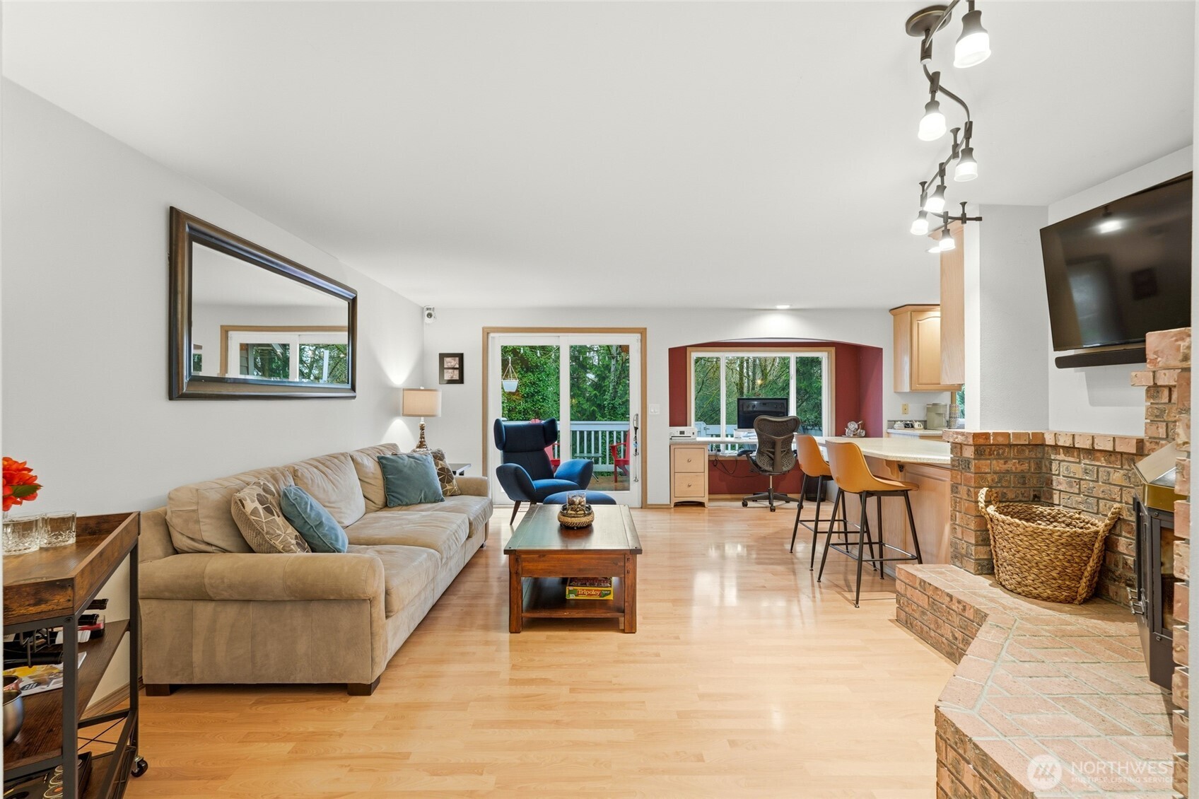 15003 104th Avenue Northeast Bothell, WA 98011 - Photo 11 of 40 a living room with furniture flat screen tv and a large window
