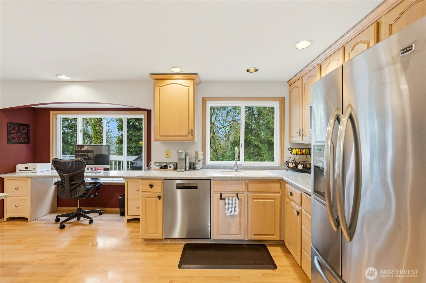 15003 104th Avenue Northeast Bothell, WA 98011 - Photo 17 of 40 a view of a kitchen with a sink dishwasher a refrigerator and cabinets