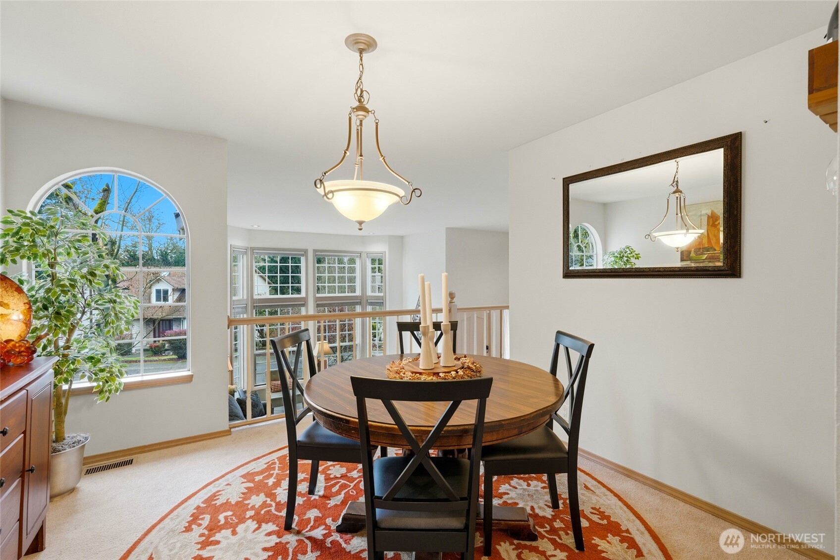 15003 104th Avenue Northeast Bothell, WA 98011 - Photo 18 of 40 a view of a dining room with furniture window and outside view