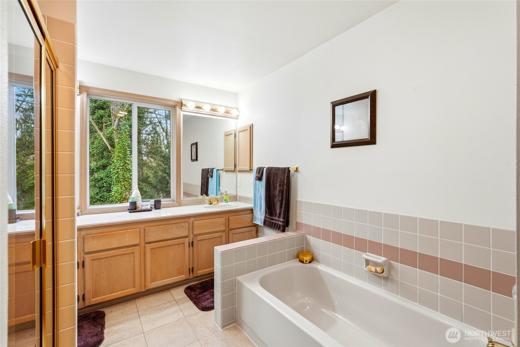 15003 104th Avenue Northeast Bothell, WA 98011 - Photo 24 of 40 a bathroom with a bathtub sink and mirror