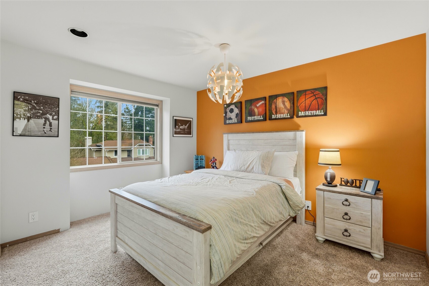 15003 104th Avenue Northeast Bothell, WA 98011 - Photo 25 of 40 a bedroom with a bed dresser and a window
