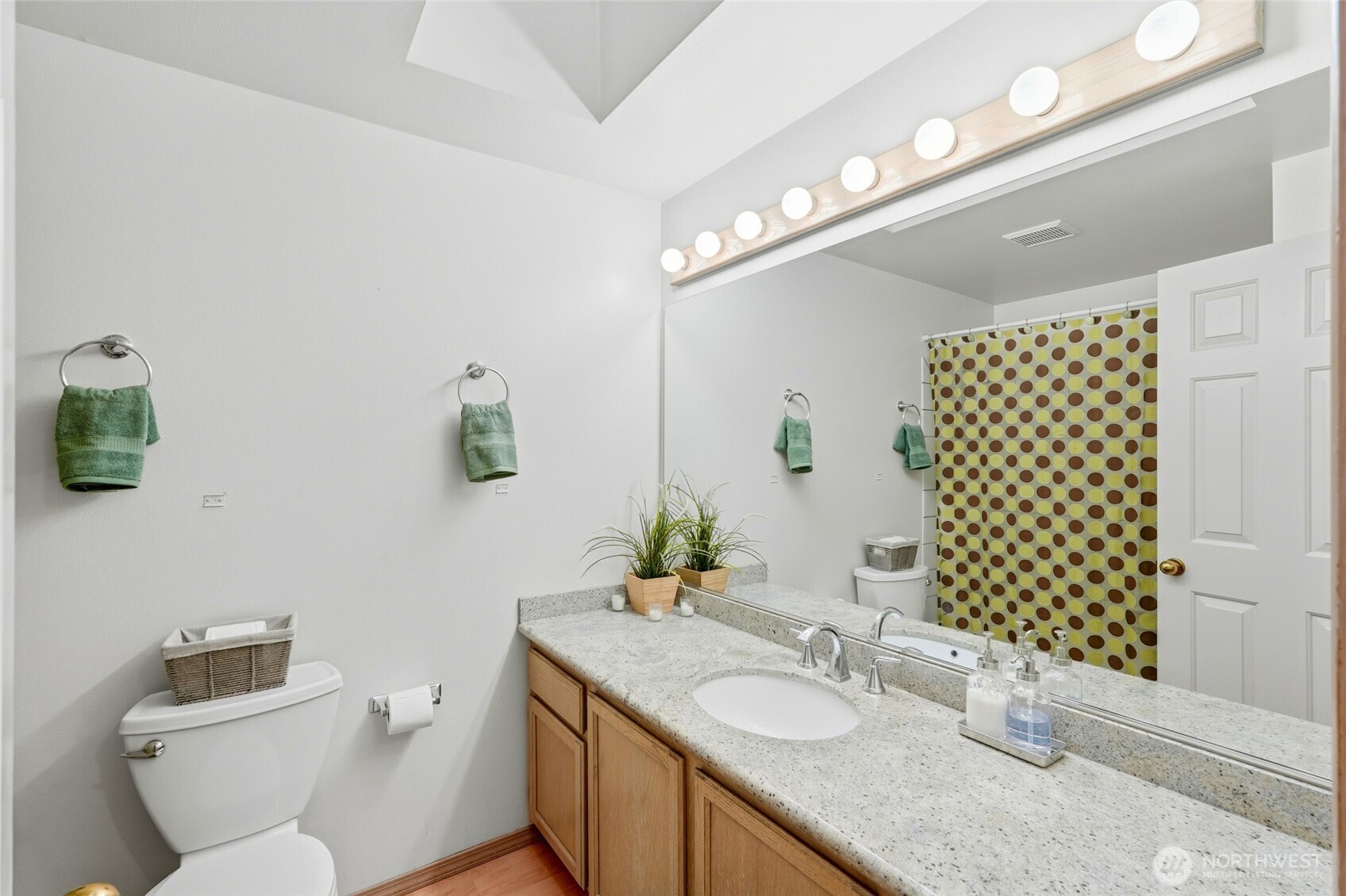 15003 104th Avenue Northeast Bothell, WA 98011 - Photo 27 of 40 a bathroom with a granite countertop double vanity sink mirror and toilet