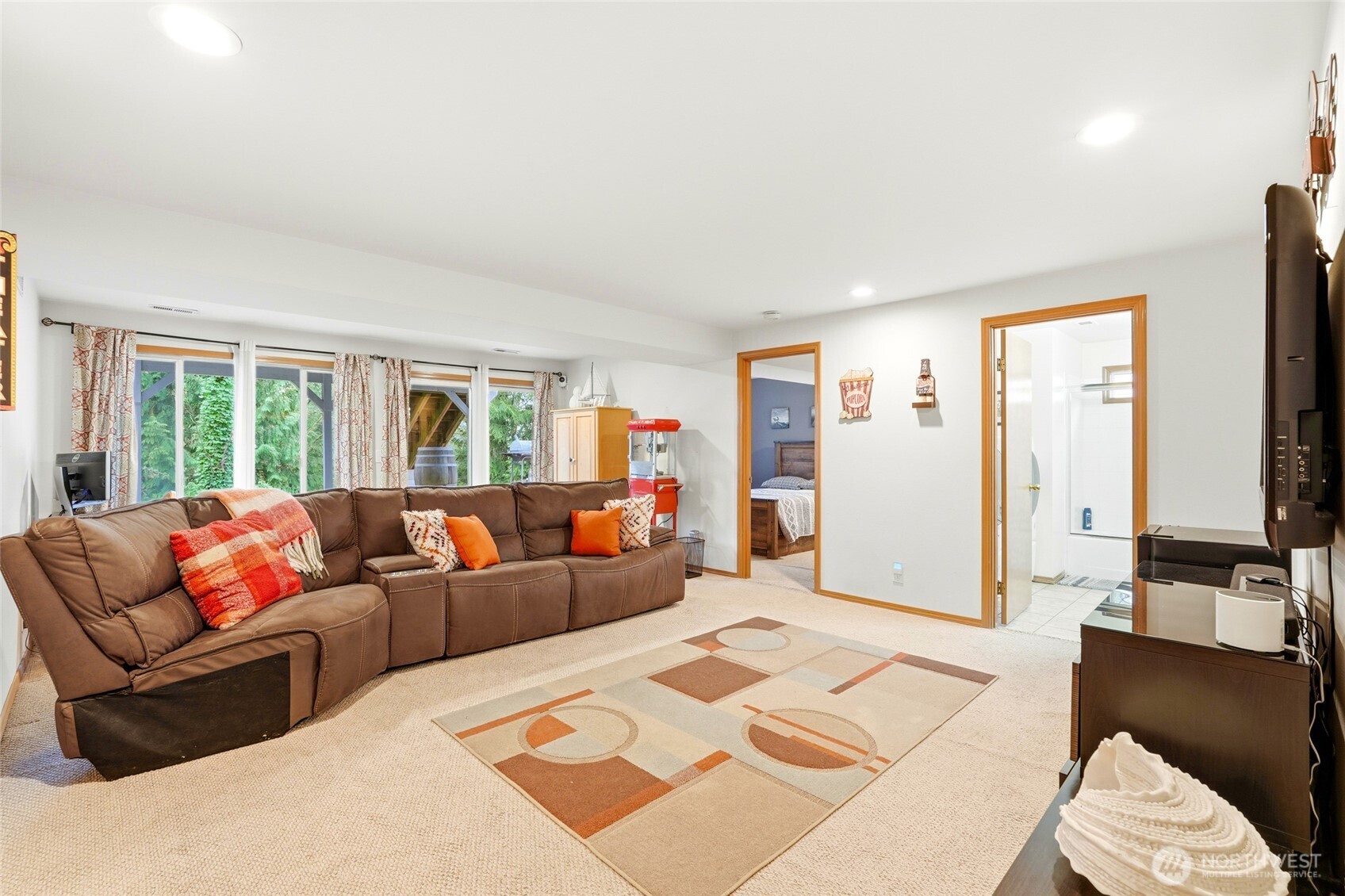 15003 104th Avenue Northeast Bothell, WA 98011 - Photo 28 of 40 a living room with furniture and a large window