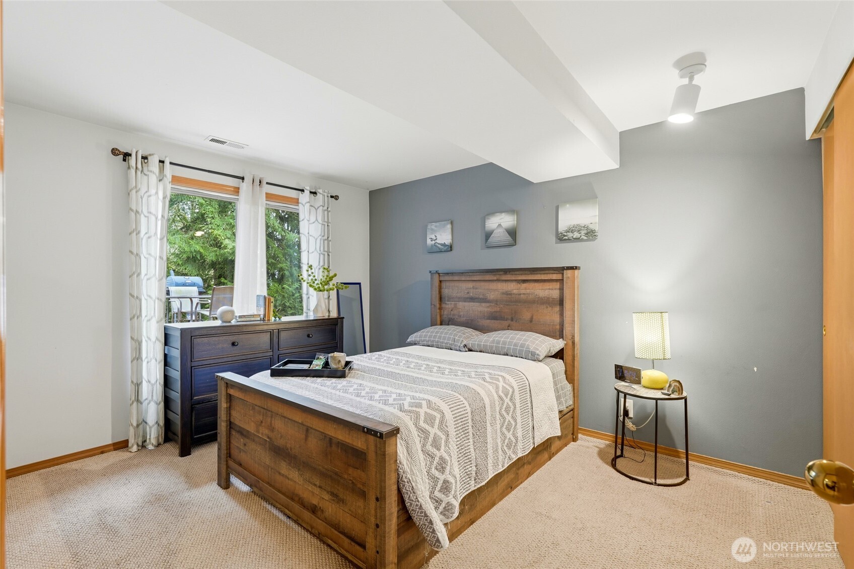 15003 104th Avenue Northeast Bothell, WA 98011 - Photo 30 of 40 a bedroom with a bed and a window