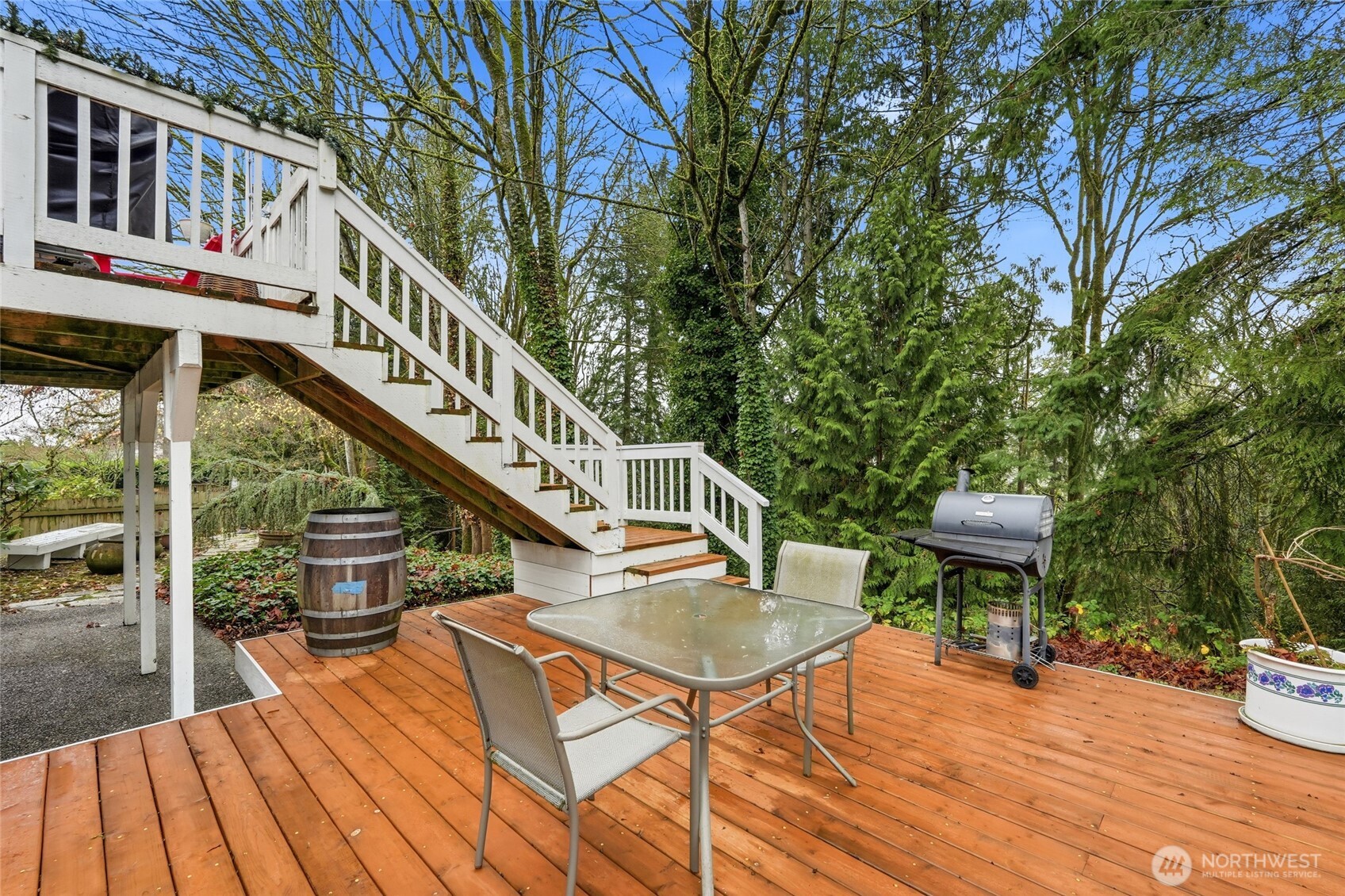 15003 104th Avenue Northeast Bothell, WA 98011 - Photo 35 of 40 a balcony with chairs and wooden floor