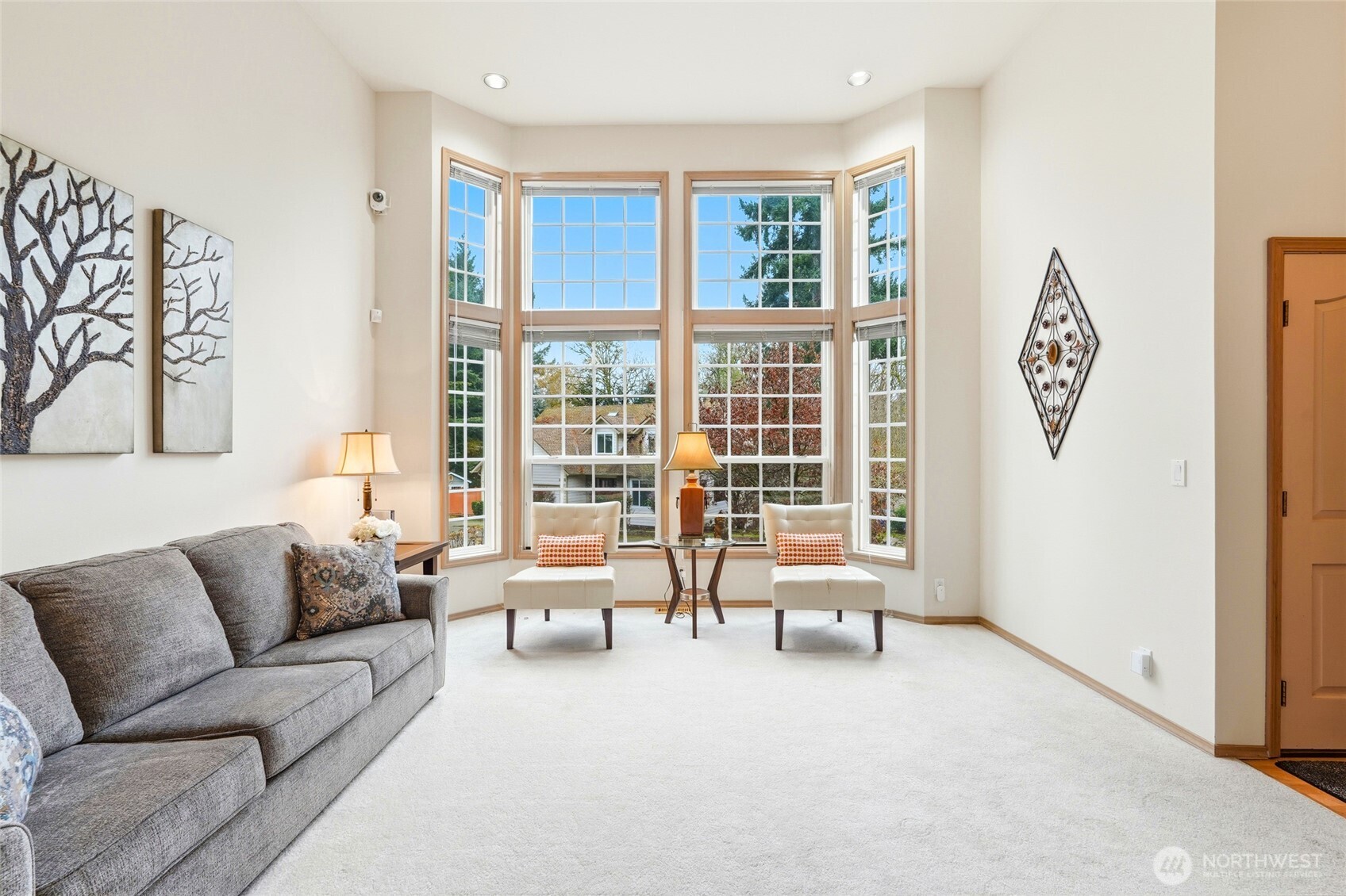 15003 104th Avenue Northeast Bothell, WA 98011 - Photo 6 of 40 a living room with furniture and a large window