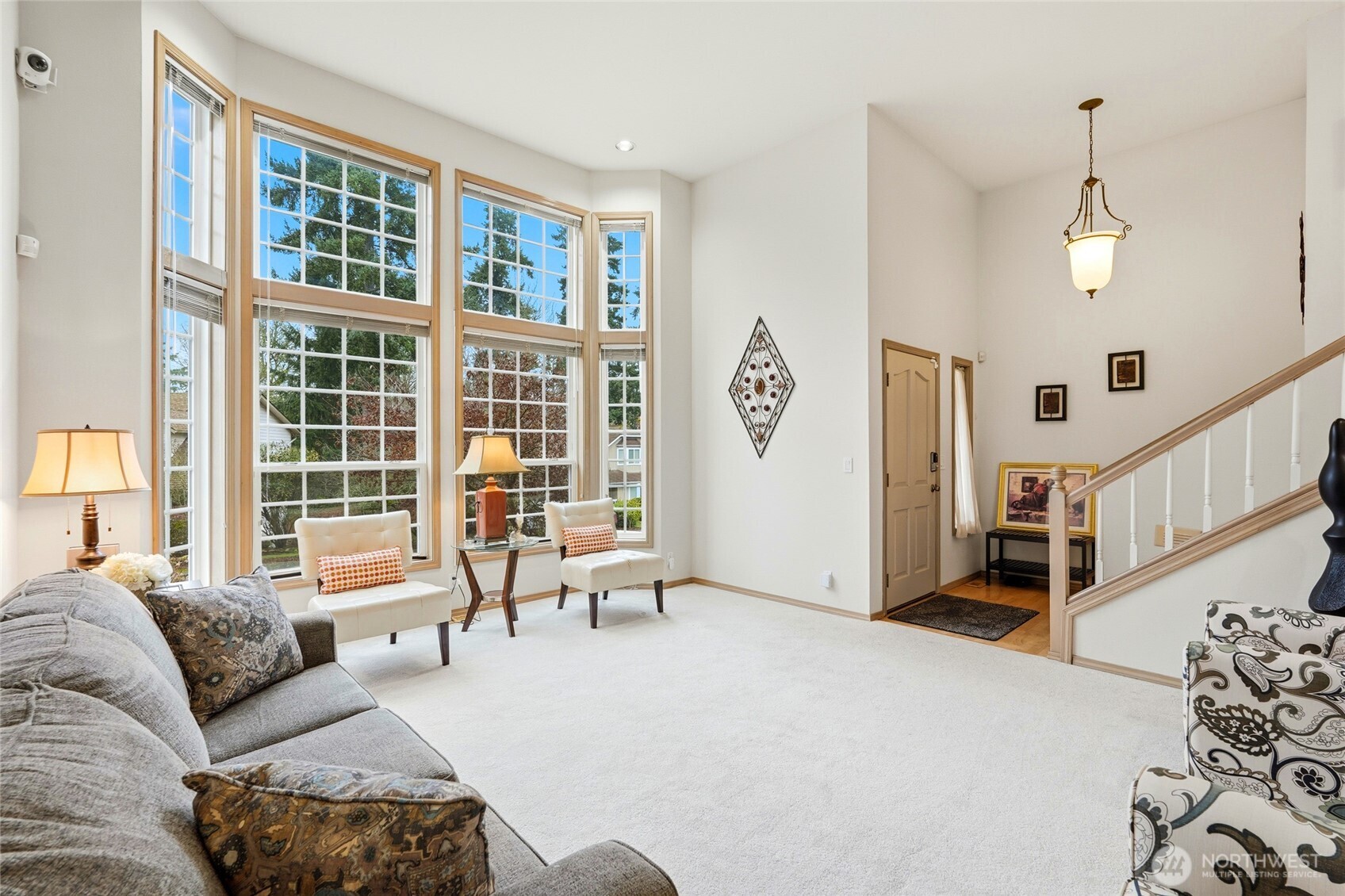 15003 104th Avenue Northeast Bothell, WA 98011 - Photo 7 of 40 a living room with furniture and windows