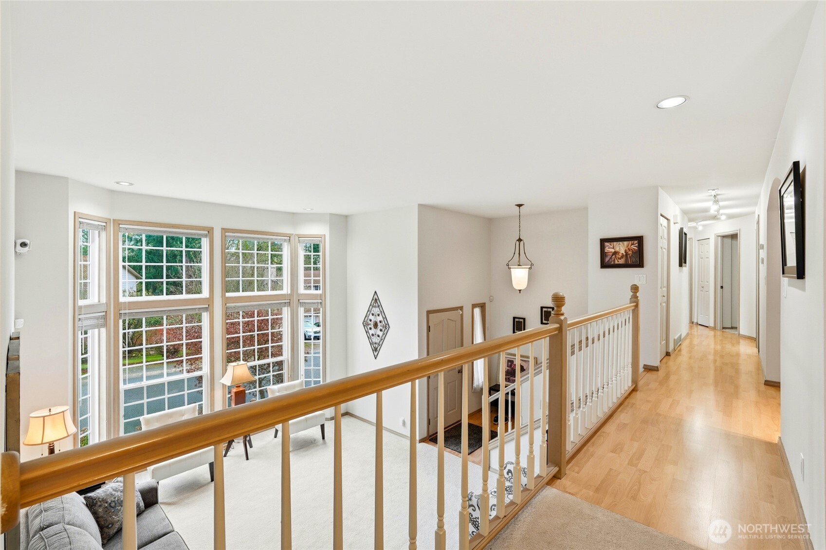 15003 104th Avenue Northeast Bothell, WA 98011 - Photo 9 of 40 a view of a hallway with wooden floor and staircase