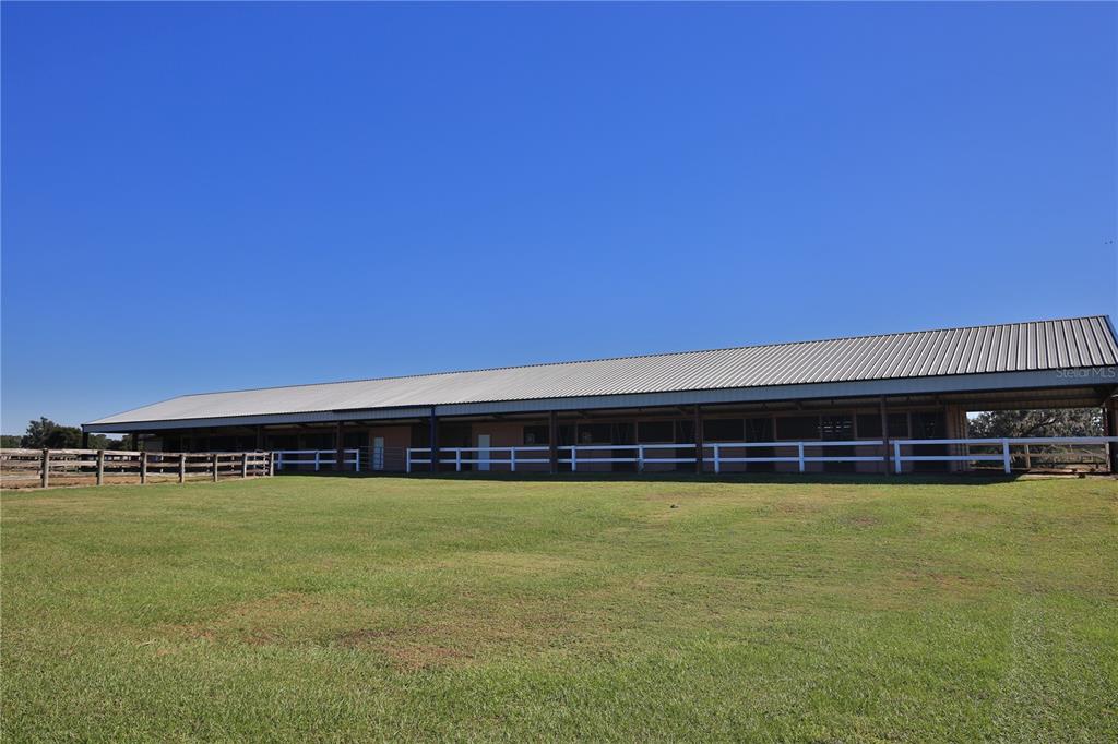 2711 Southwest 125th Avenue Ocala, FL 34481 - Photo 2 of 49 a view of a swimming pool and an outdoor space