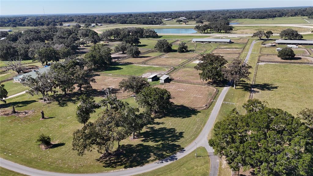2711 Southwest 125th Avenue Ocala, FL 34481 - Photo 26 of 49 a view of a lake with a yard and mountain in the back