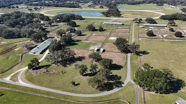an aerial view of a house with outdoor space