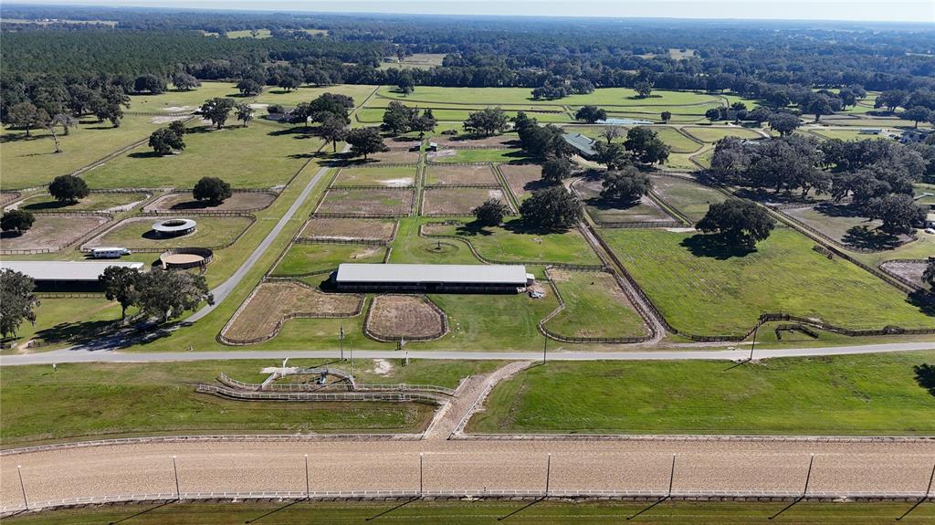 2711 Southwest 125th Avenue Ocala, FL 34481 - Photo 38 of 49 an aerial view of a house with a garden and swimming pool