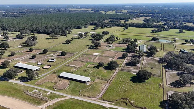an aerial view of a house with outdoor space
